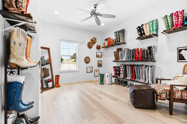 a living room with lots of furniture and a book shelf