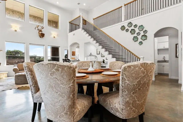 a living room with fireplace furniture and a wooden floor