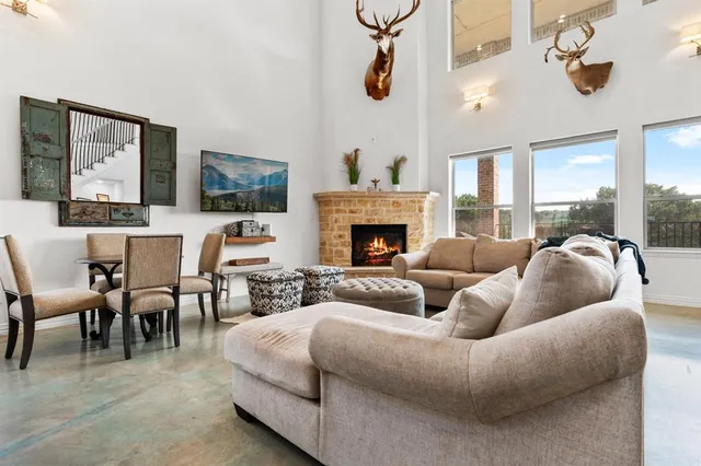 a living room with furniture fireplace and flat screen tv