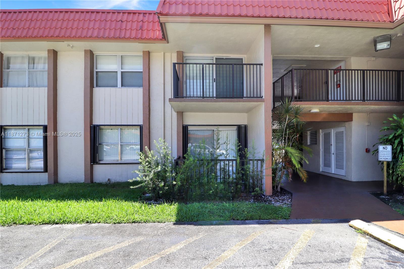 10511 Southwest 108th Avenue, Unit 185 Miami, FL 33176 - Photo 1 of 18 a front view of a house with a garden and plants