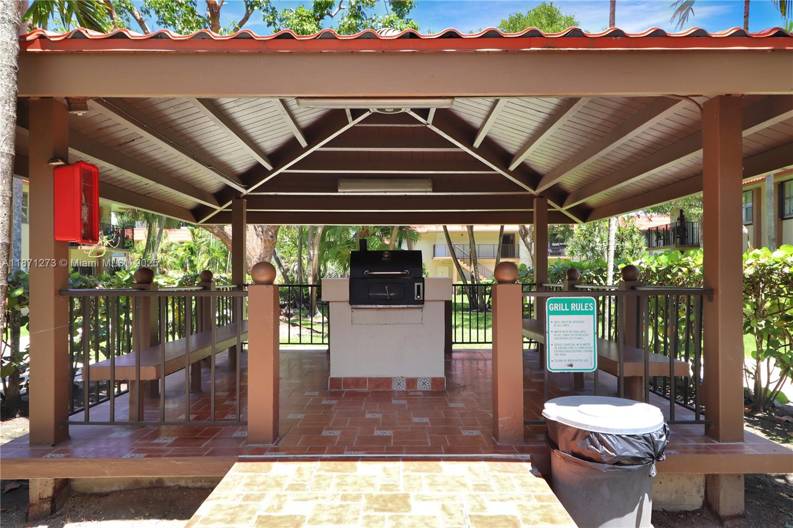 10511 Southwest 108th Avenue, Unit 185 Miami, FL 33176 - Photo 17 of 18 a view of a porch with furniture and floor to ceiling window