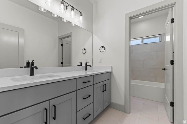 562 West Coyote Rdg Road Grantsville, UT 84029 - Photo 24 of 27 Bathroom featuring a dual vanity with light gray cabinetry, white countertops, and matte black hardware