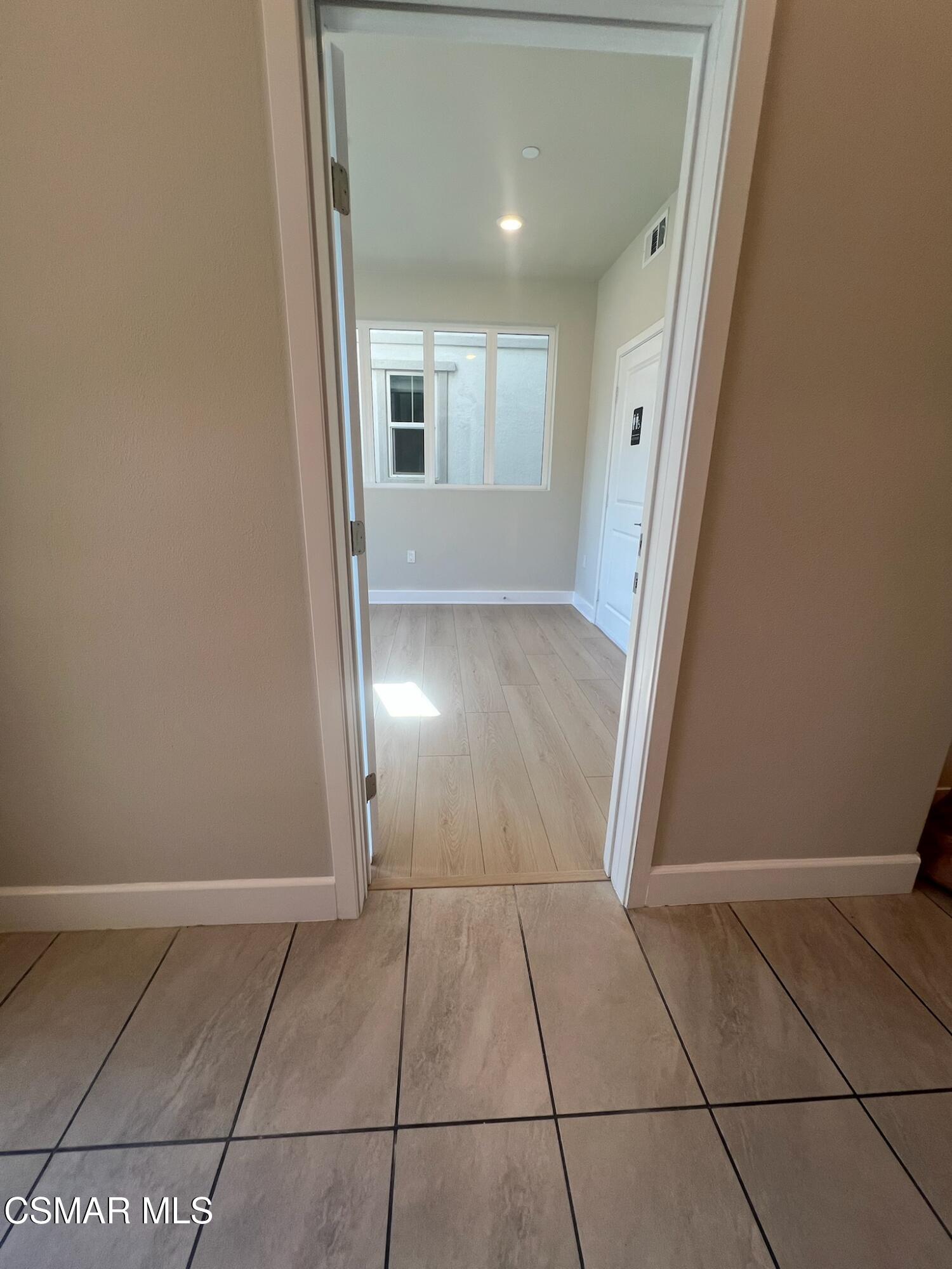 3005 Cochran Street Simi Valley, CA 93065 - Photo 15 of 57 a view of a livingroom with an empty space and a window