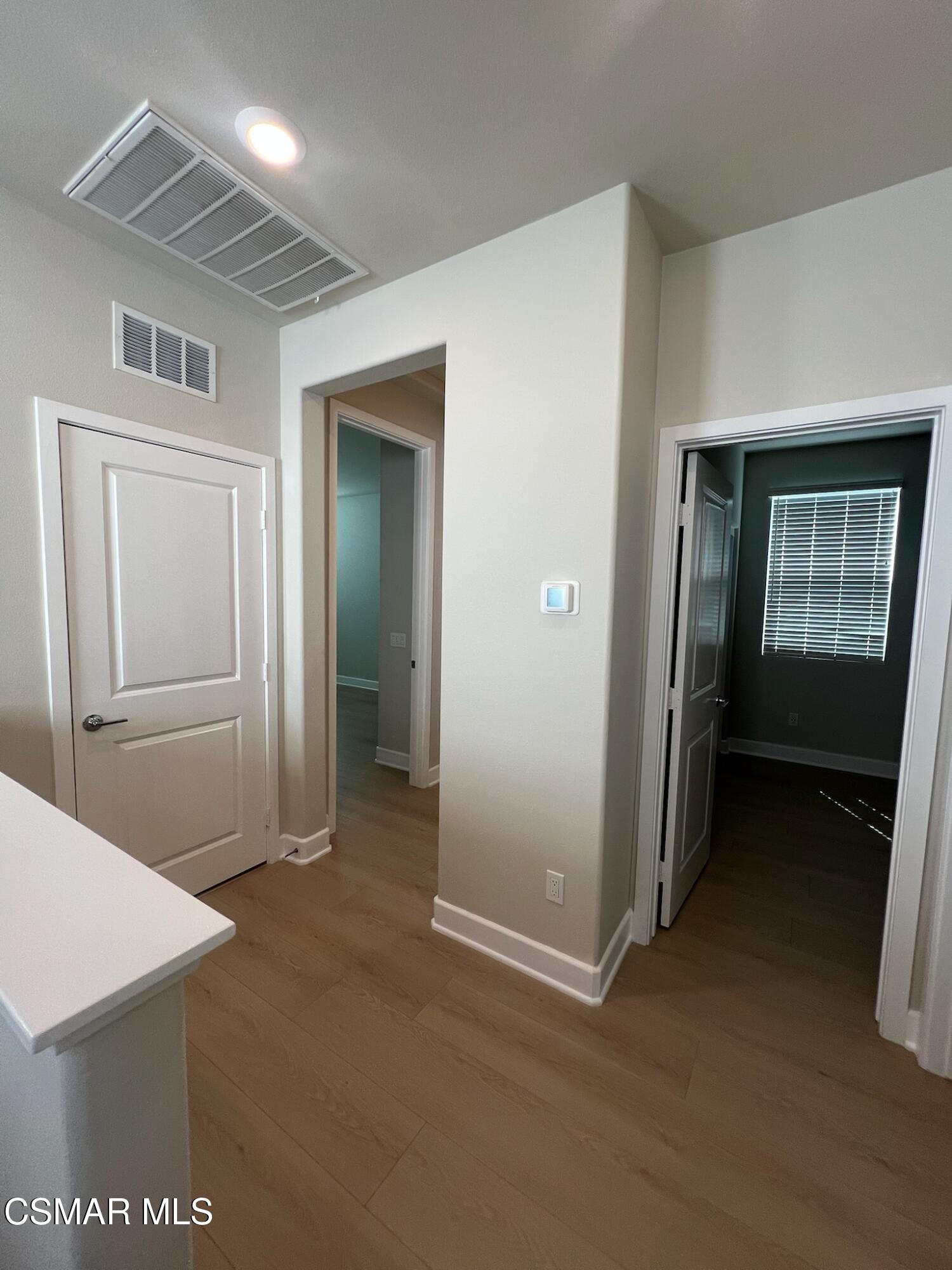 3005 Cochran Street Simi Valley, CA 93065 - Photo 26 of 57 a view of a hallway with wooden floor and closet