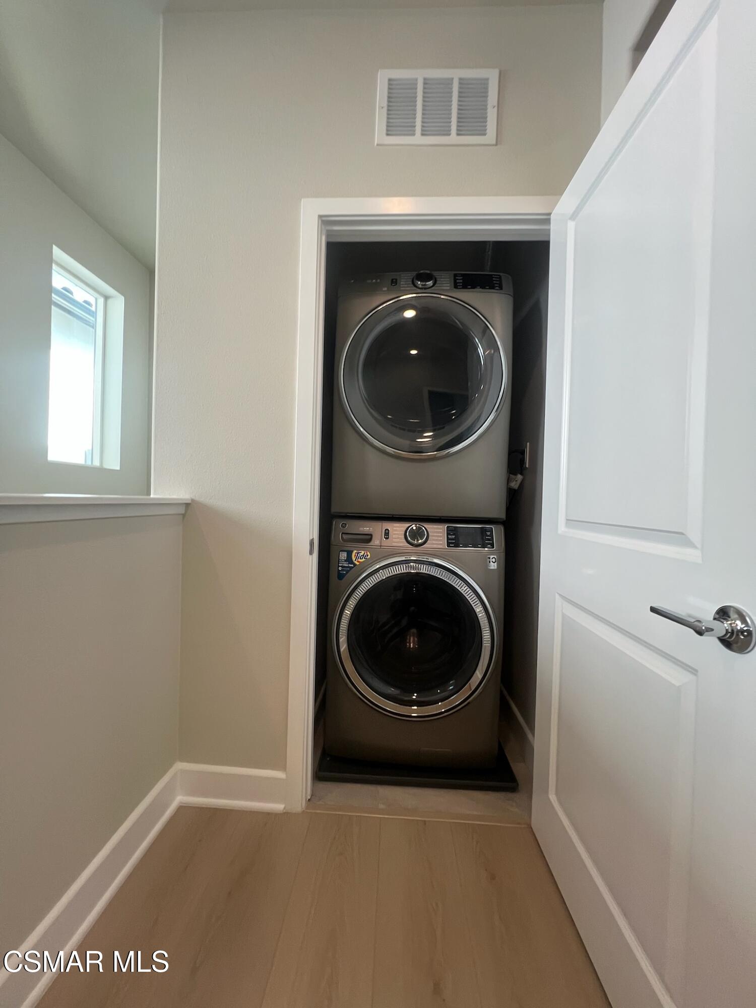 3005 Cochran Street Simi Valley, CA 93065 - Photo 28 of 57 a view of a hallway with washer and dryer