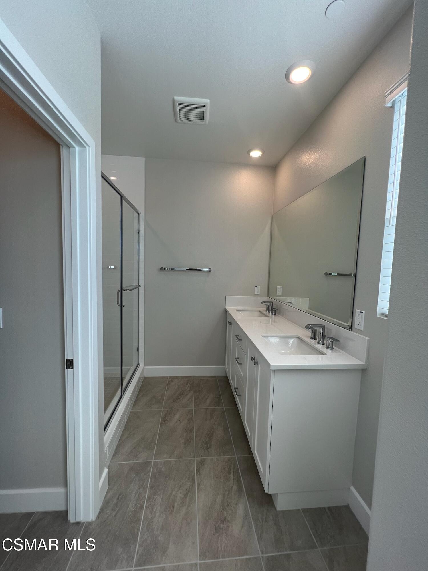 3005 Cochran Street Simi Valley, CA 93065 - Photo 34 of 57 a kitchen with a sink and a refrigerator