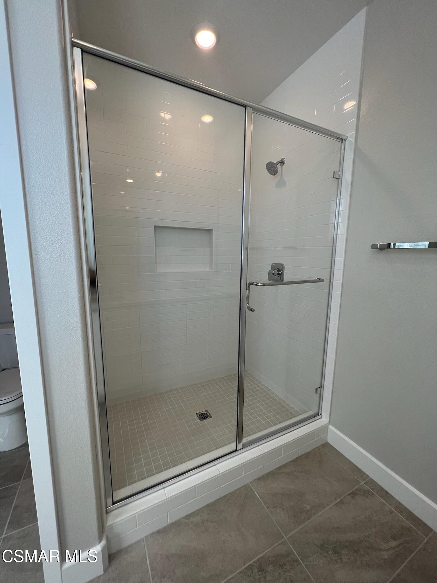 3005 Cochran Street Simi Valley, CA 93065 - Photo 36 of 57 a bathroom with a glass shower door