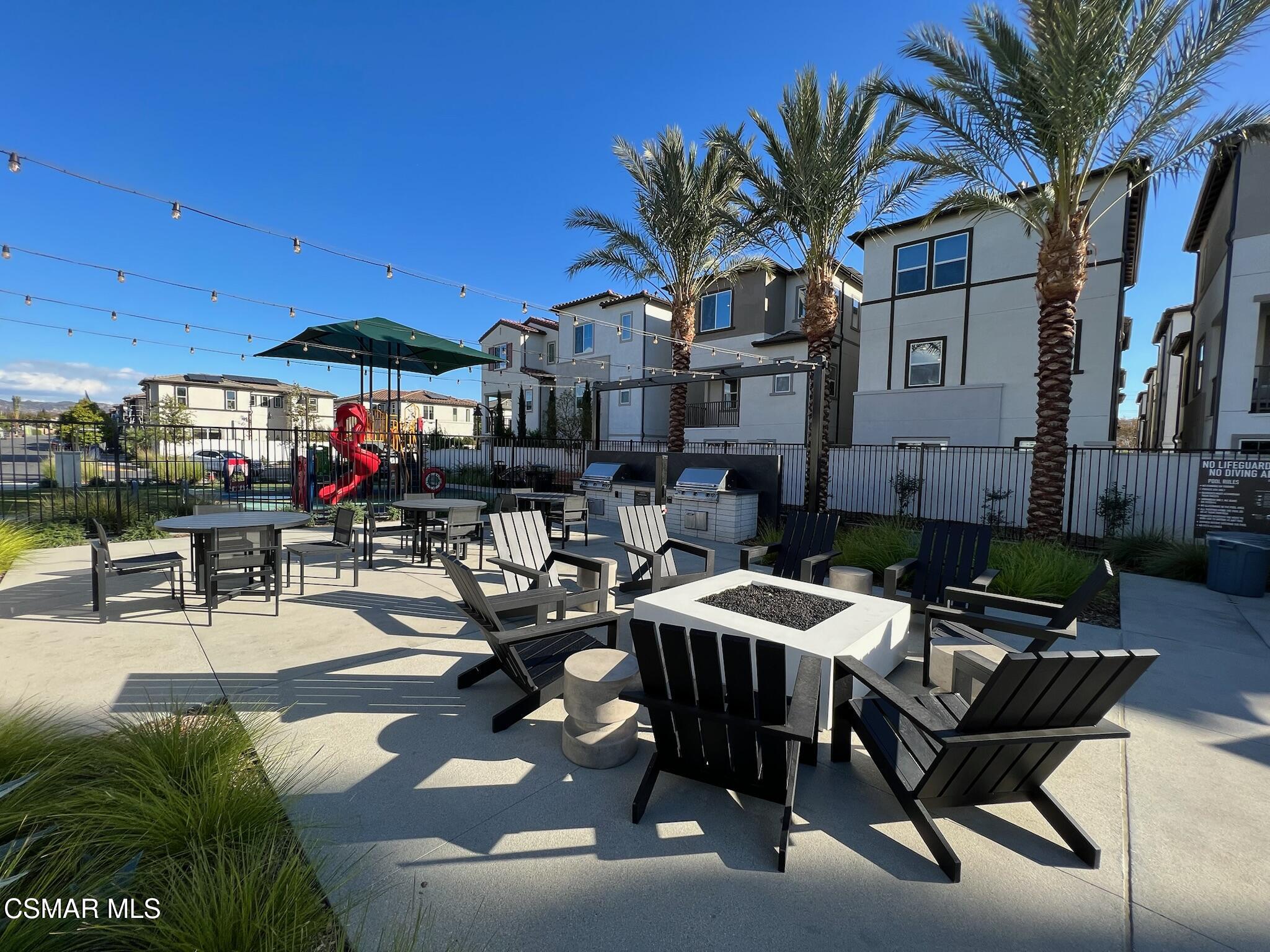 3005 Cochran Street Simi Valley, CA 93065 - Photo 55 of 57 a patio with a table and chairs and a barbeque