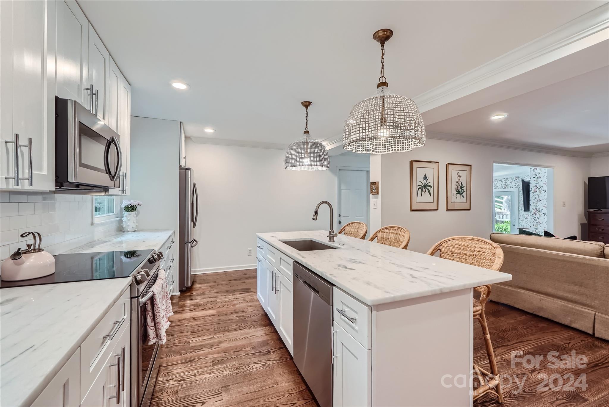 3910 Chevington Road Charlotte, NC 28226 - Photo 13 of 40 a kitchen with granite countertop a sink stove and refrigerator