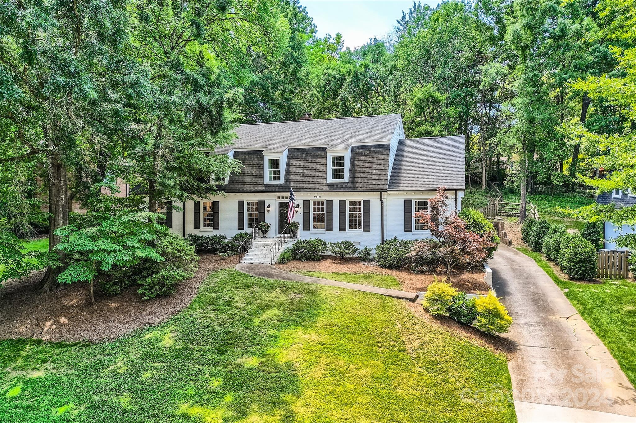 3910 Chevington Road Charlotte, NC 28226 - Photo 2 of 40 a view of a house with a swimming pool