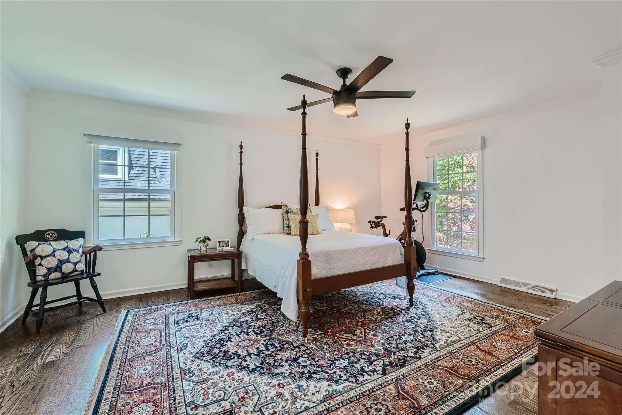 3910 Chevington Road Charlotte, NC 28226 - Photo 23 of 40 a bedroom with a bed and wooden floor