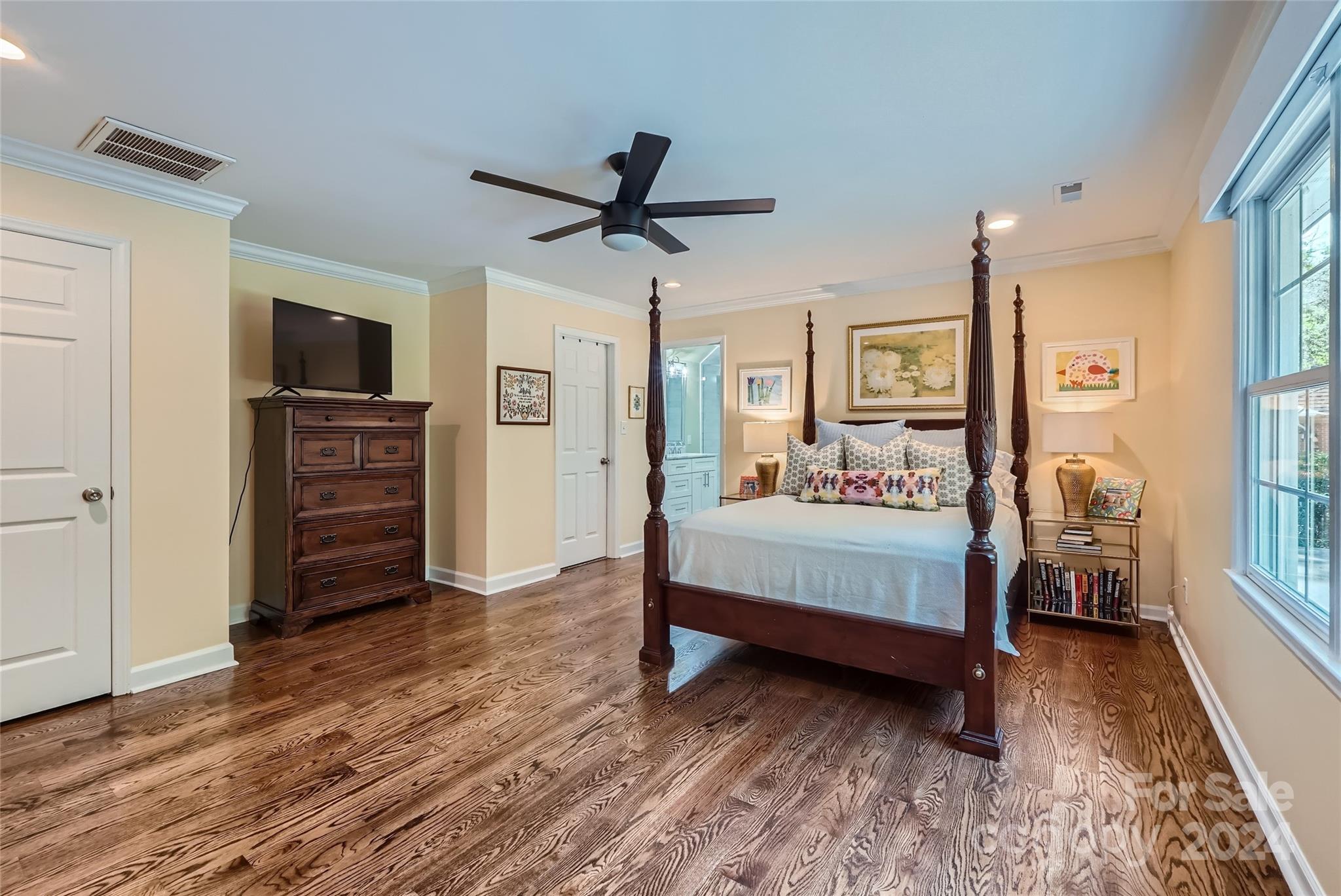 3910 Chevington Road Charlotte, NC 28226 - Photo 29 of 40 a bedroom with a bed and a tv on table