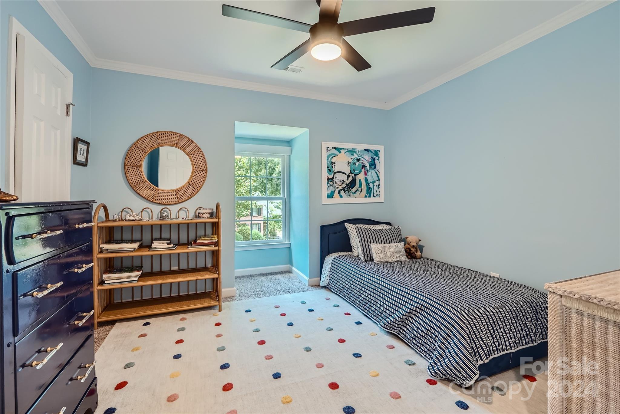 3910 Chevington Road Charlotte, NC 28226 - Photo 33 of 40 a bedroom with a bed a dresser and book shelf