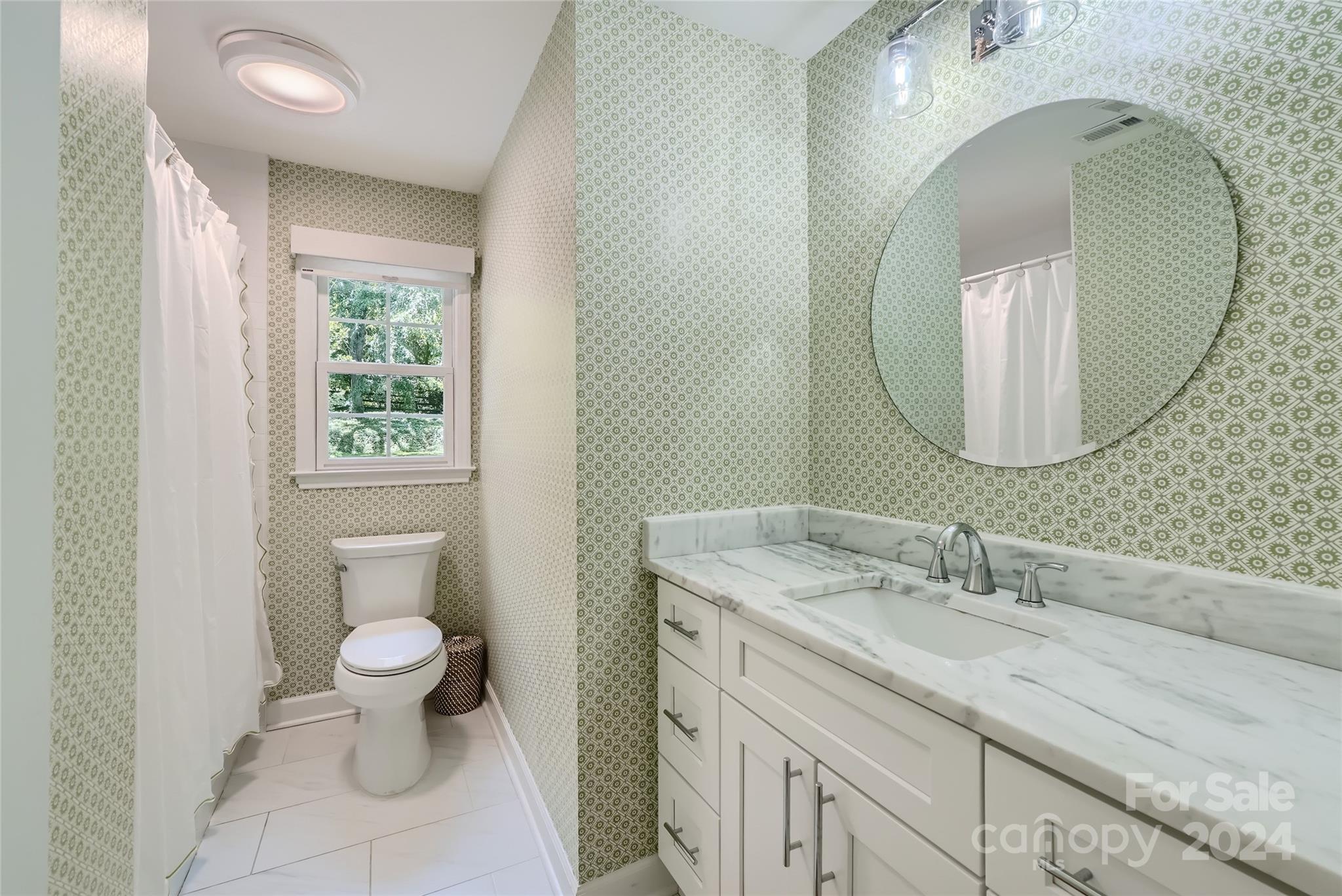 3910 Chevington Road Charlotte, NC 28226 - Photo 35 of 40 a bathroom with a granite countertop toilet a sink and mirror