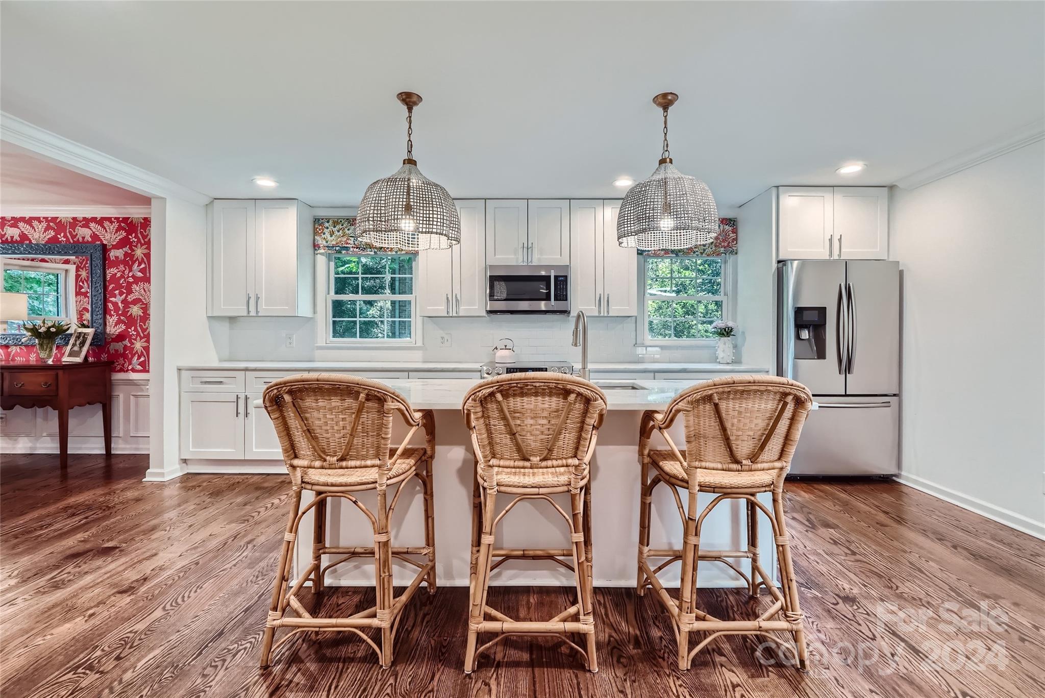 3910 Chevington Road Charlotte, NC 28226 - Photo 10 of 40 a dining room with furniture a chandelier and wooden floor
