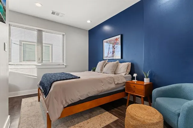 a bedroom with bed and a window