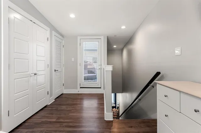 a view of an entryway with wooden floor