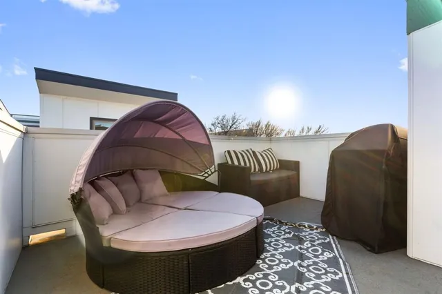 a living room with furniture and a rug