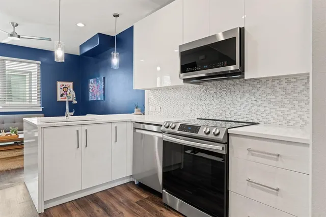 a kitchen with a stove and a microwave