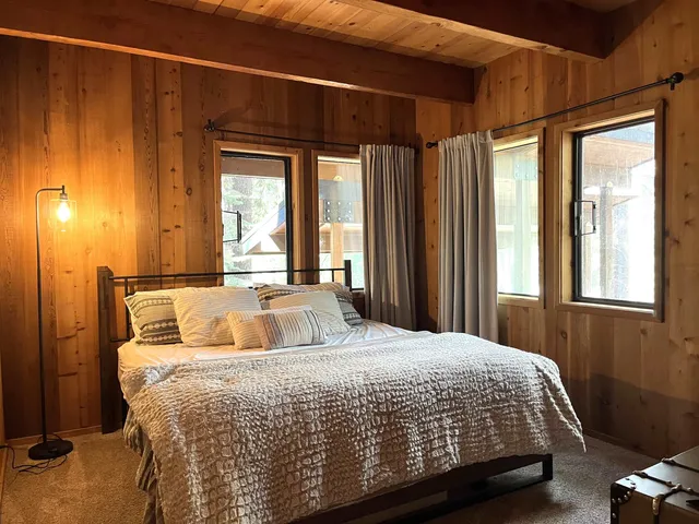 a bedroom with a bed and window