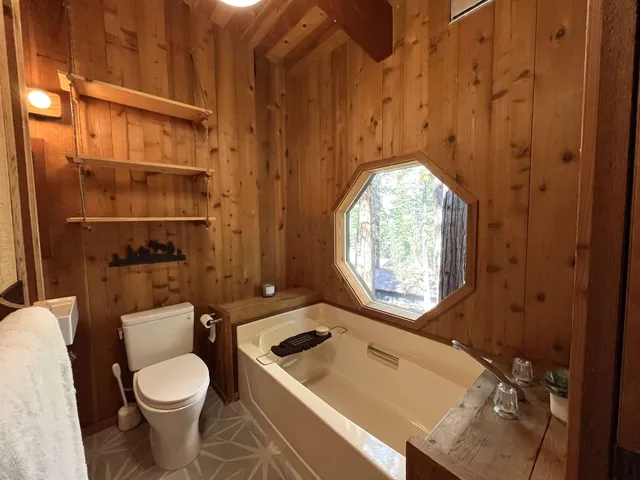 a bathroom with a toilet a sink and a bathtub