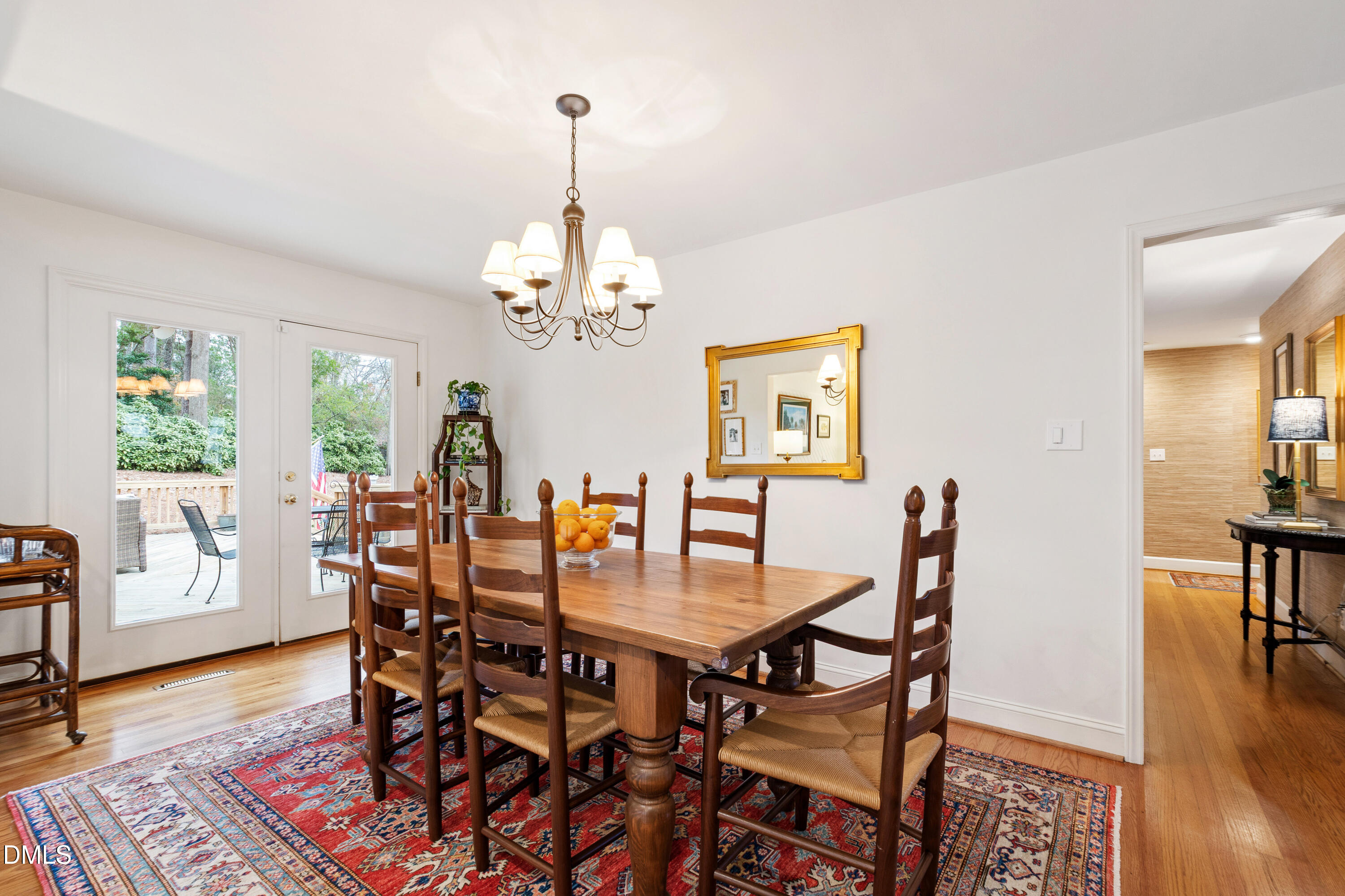 908 Brookwood Drive Raleigh, NC 27607 - Photo 11 of 27 a view of a dining room with furniture wooden floor and chandelier