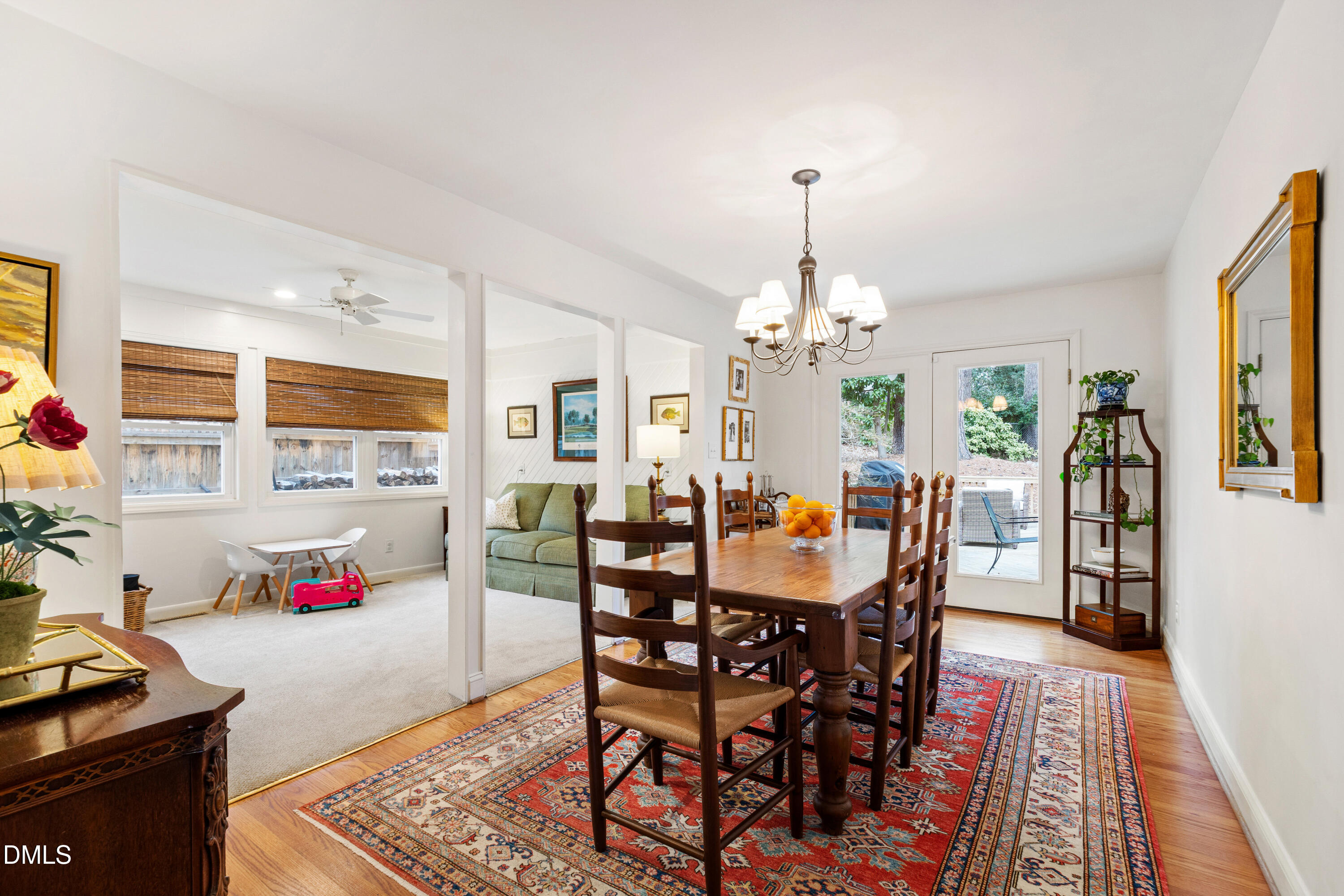 908 Brookwood Drive Raleigh, NC 27607 - Photo 12 of 27 a view of a dining room with furniture window and wooden floor
