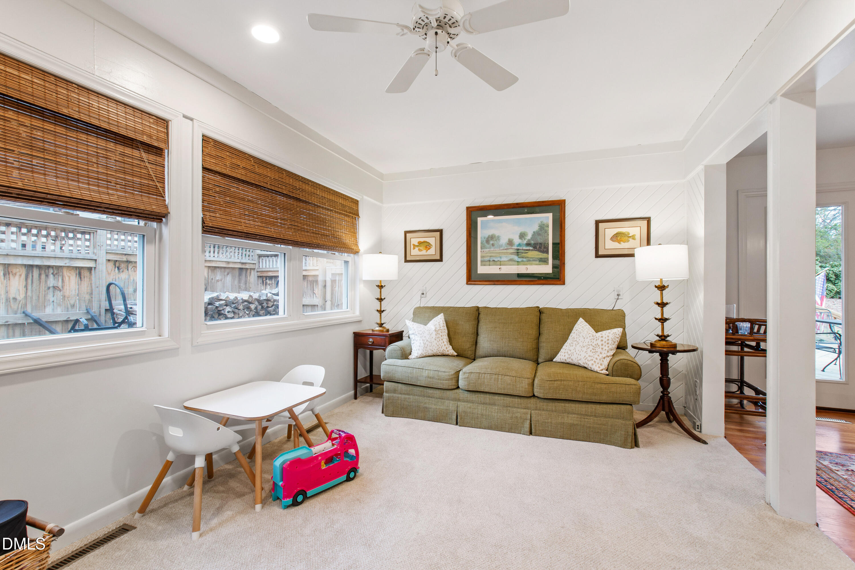 908 Brookwood Drive Raleigh, NC 27607 - Photo 13 of 27 a living room with furniture and a large window