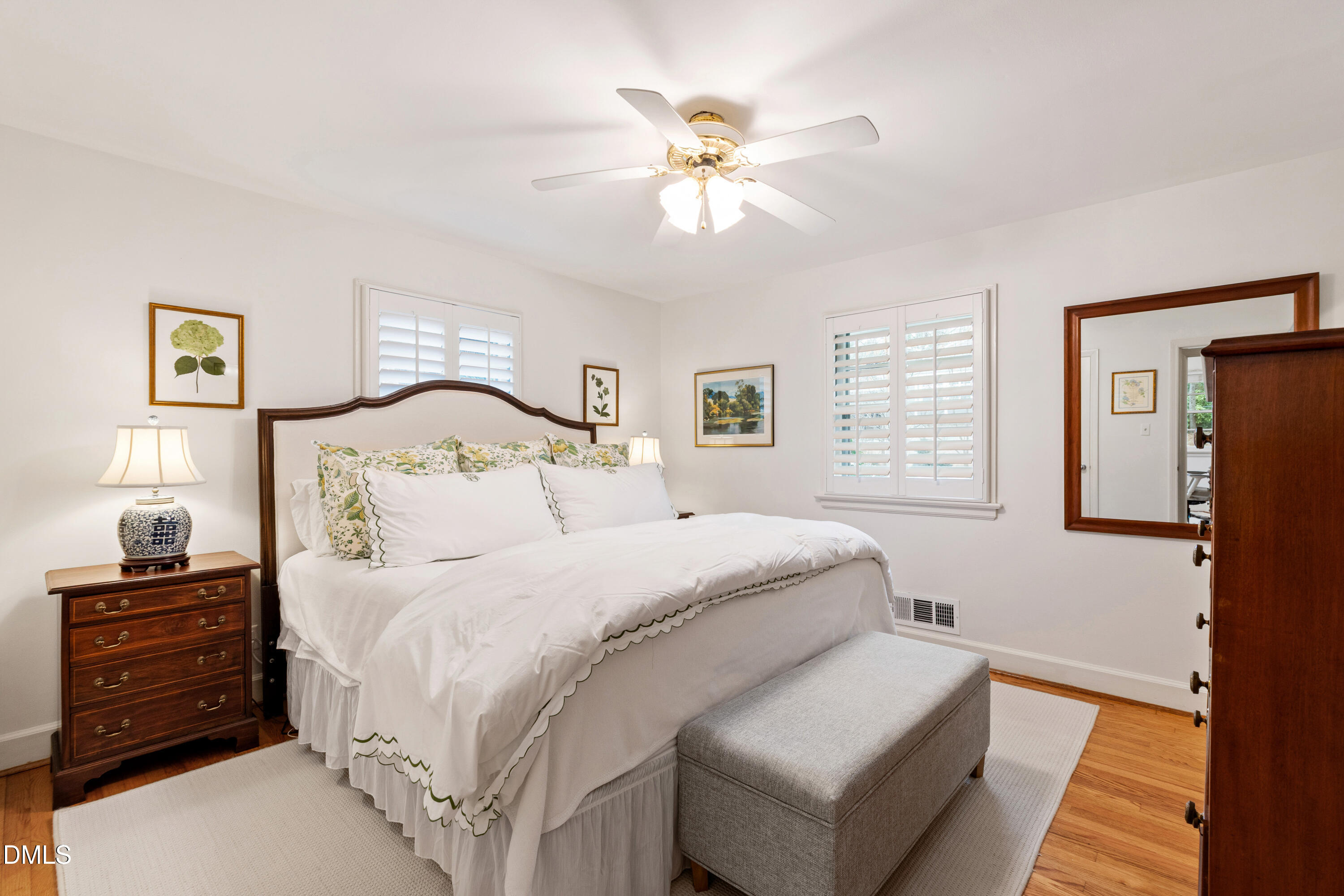 908 Brookwood Drive Raleigh, NC 27607 - Photo 15 of 27 a bedroom with a bed and a window