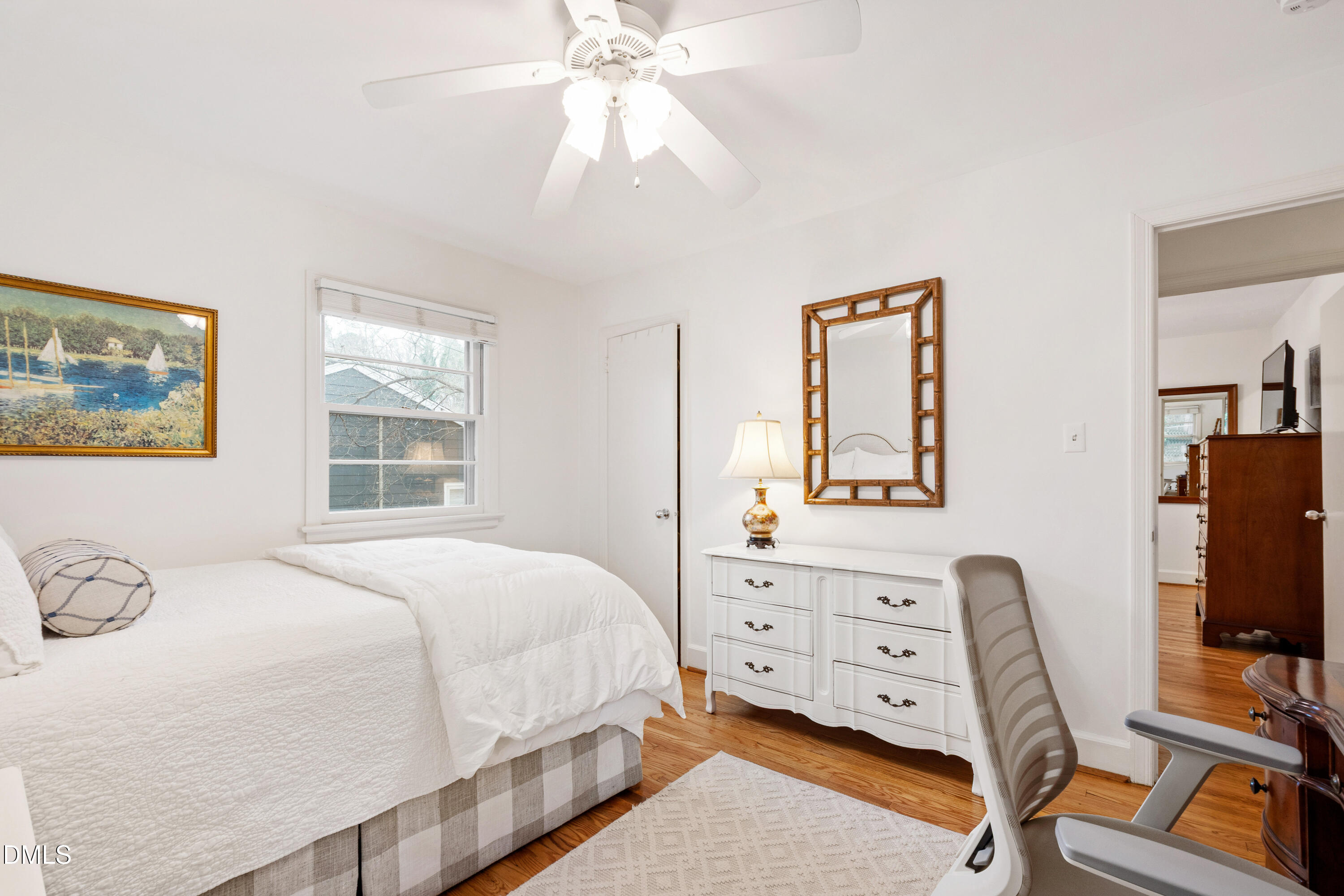 908 Brookwood Drive Raleigh, NC 27607 - Photo 17 of 27 a bedroom with a bed and a desk