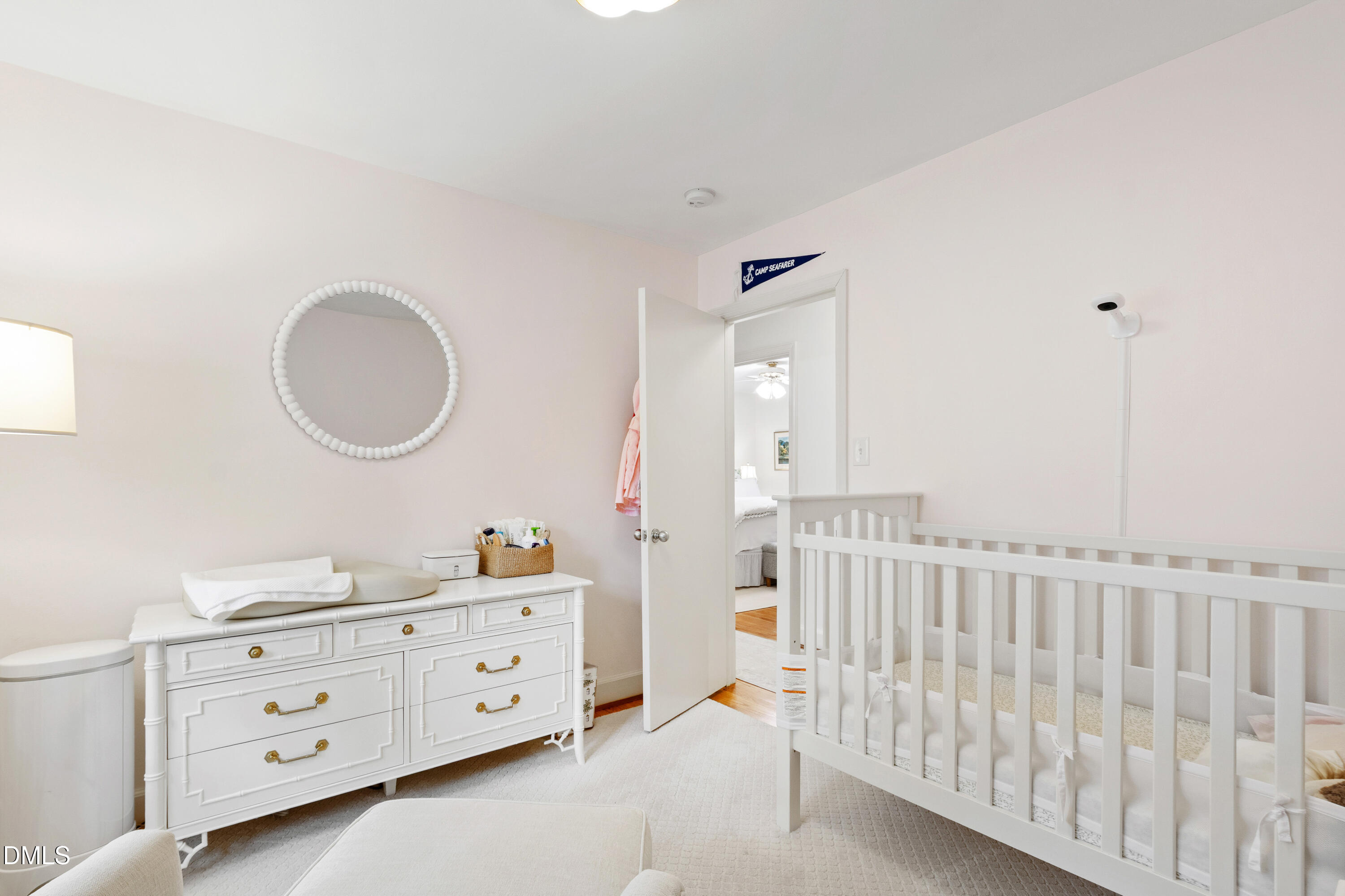 908 Brookwood Drive Raleigh, NC 27607 - Photo 19 of 27 a bedroom with a baby bed baby crib and a dresser