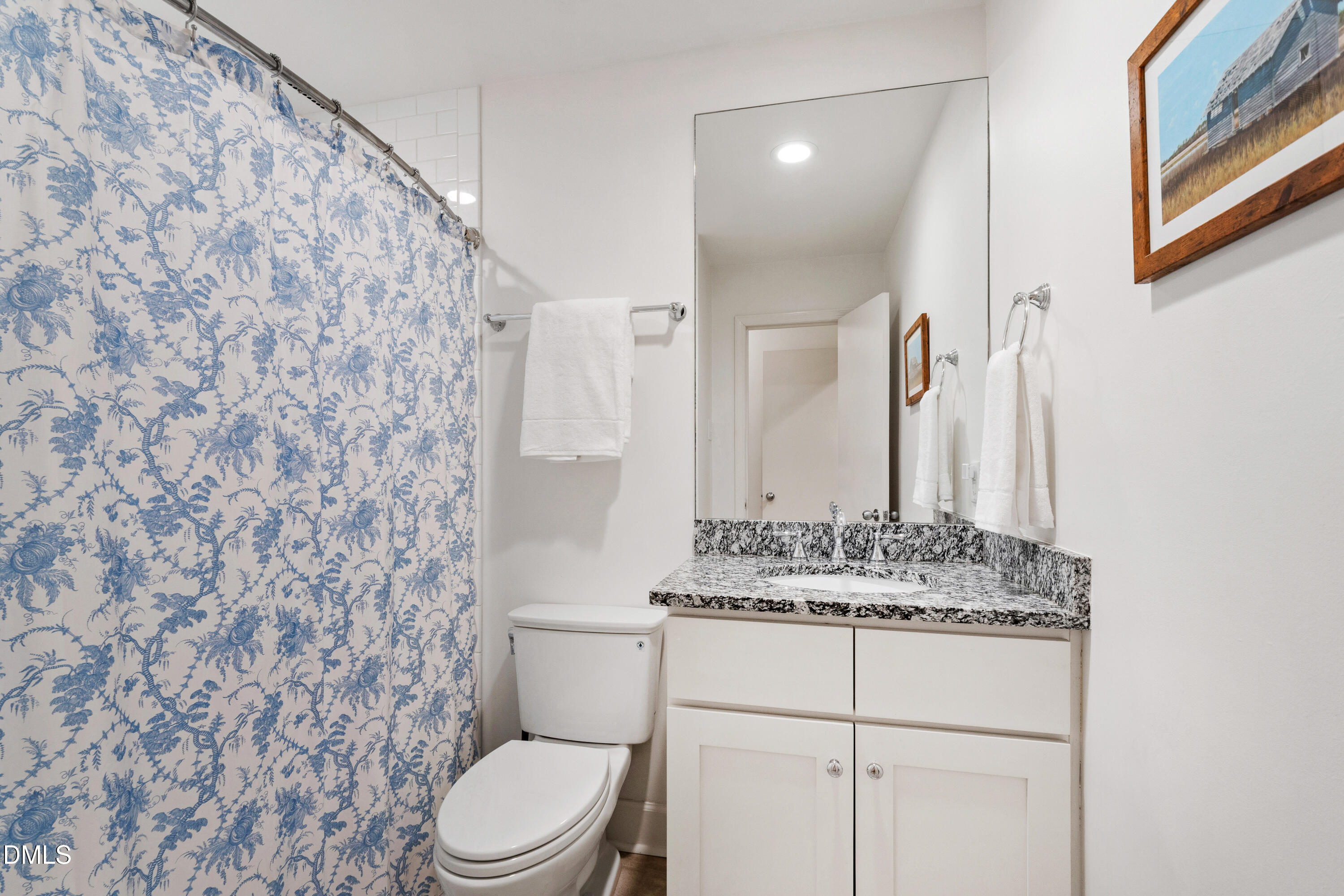 908 Brookwood Drive Raleigh, NC 27607 - Photo 20 of 27 a bathroom with a granite countertop toilet sink and mirror