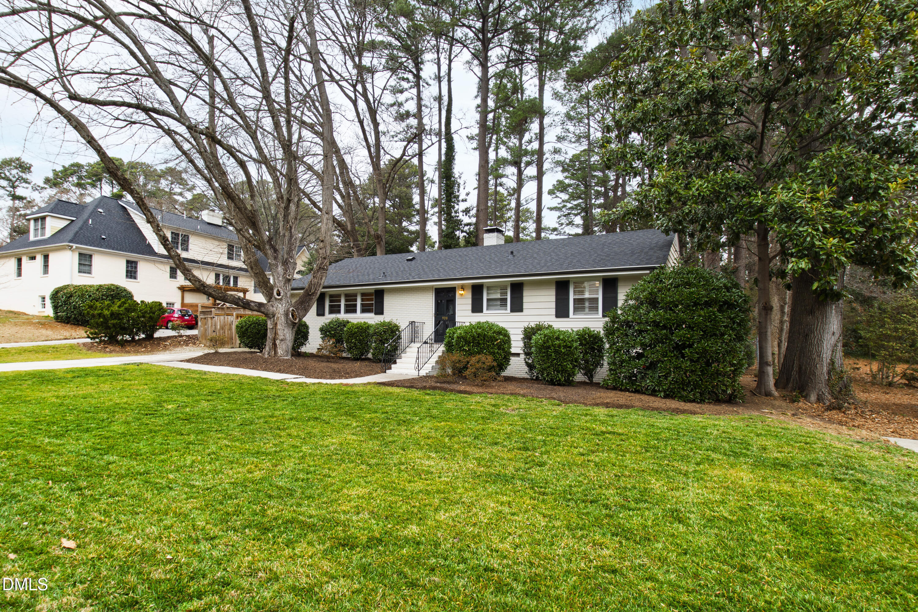 908 Brookwood Drive Raleigh, NC 27607 - Photo 2 of 27 a front view of a house with a yard