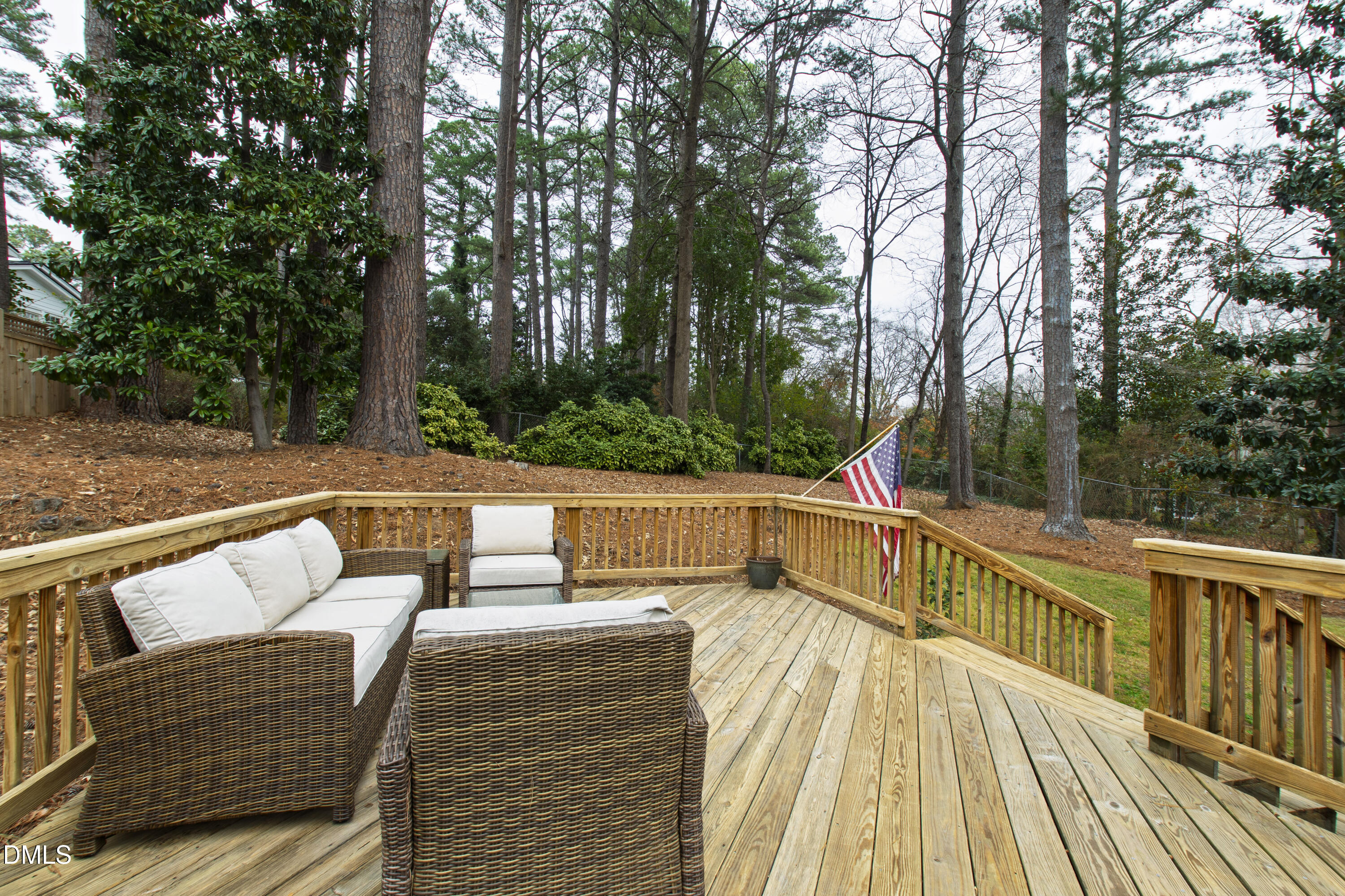 908 Brookwood Drive Raleigh, NC 27607 - Photo 23 of 27 a view of deck with furniture and trees