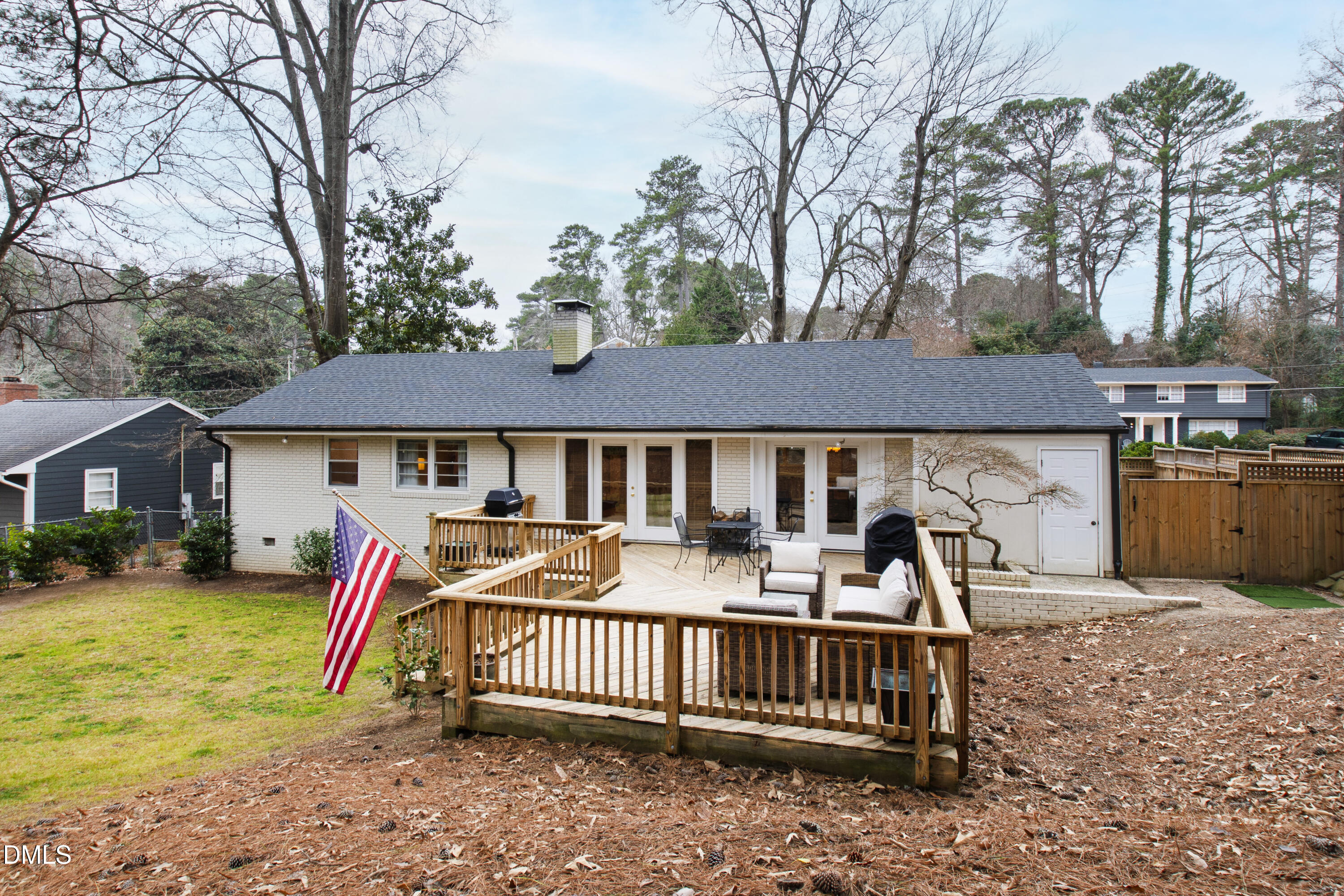 908 Brookwood Drive Raleigh, NC 27607 - Photo 24 of 27 a front view of a house with garden and patio