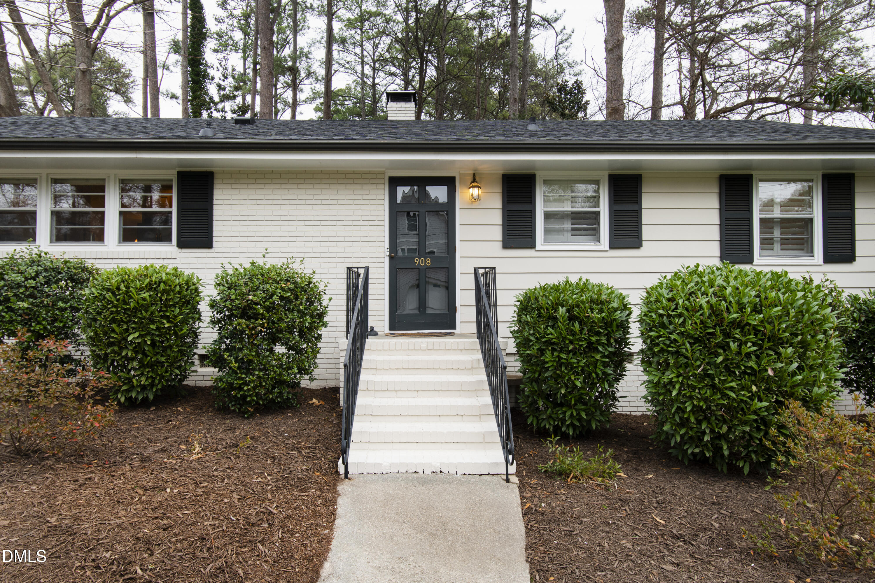 908 Brookwood Drive Raleigh, NC 27607 - Photo 3 of 27 a house with a garden view
