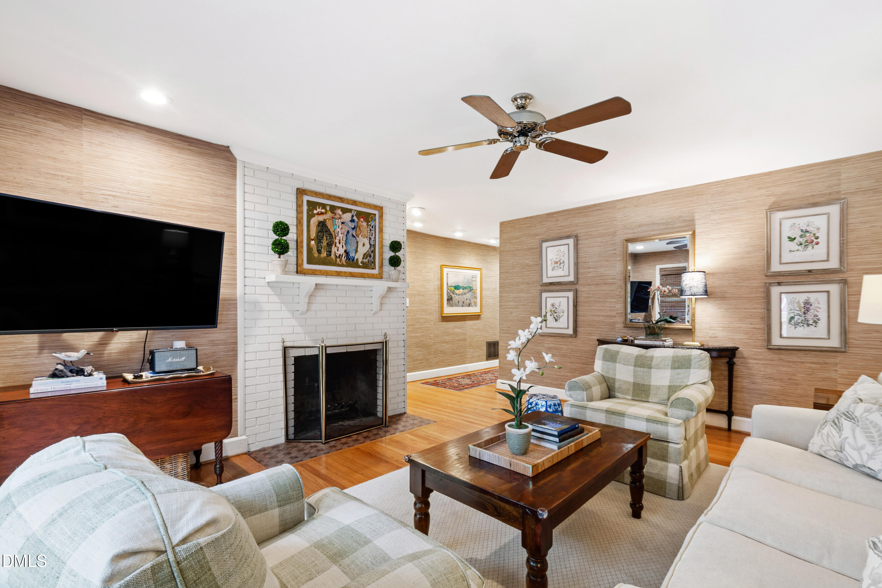 908 Brookwood Drive Raleigh, NC 27607 - Photo 6 of 27 a living room with furniture and a flat screen tv