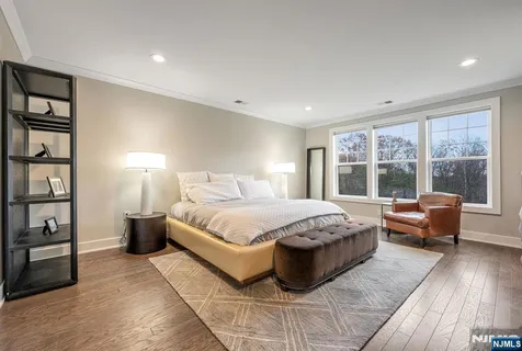 a spacious bedroom with a large bed and a window