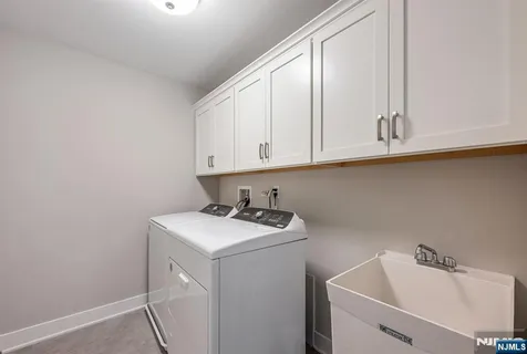 a view of a sink and cabinets