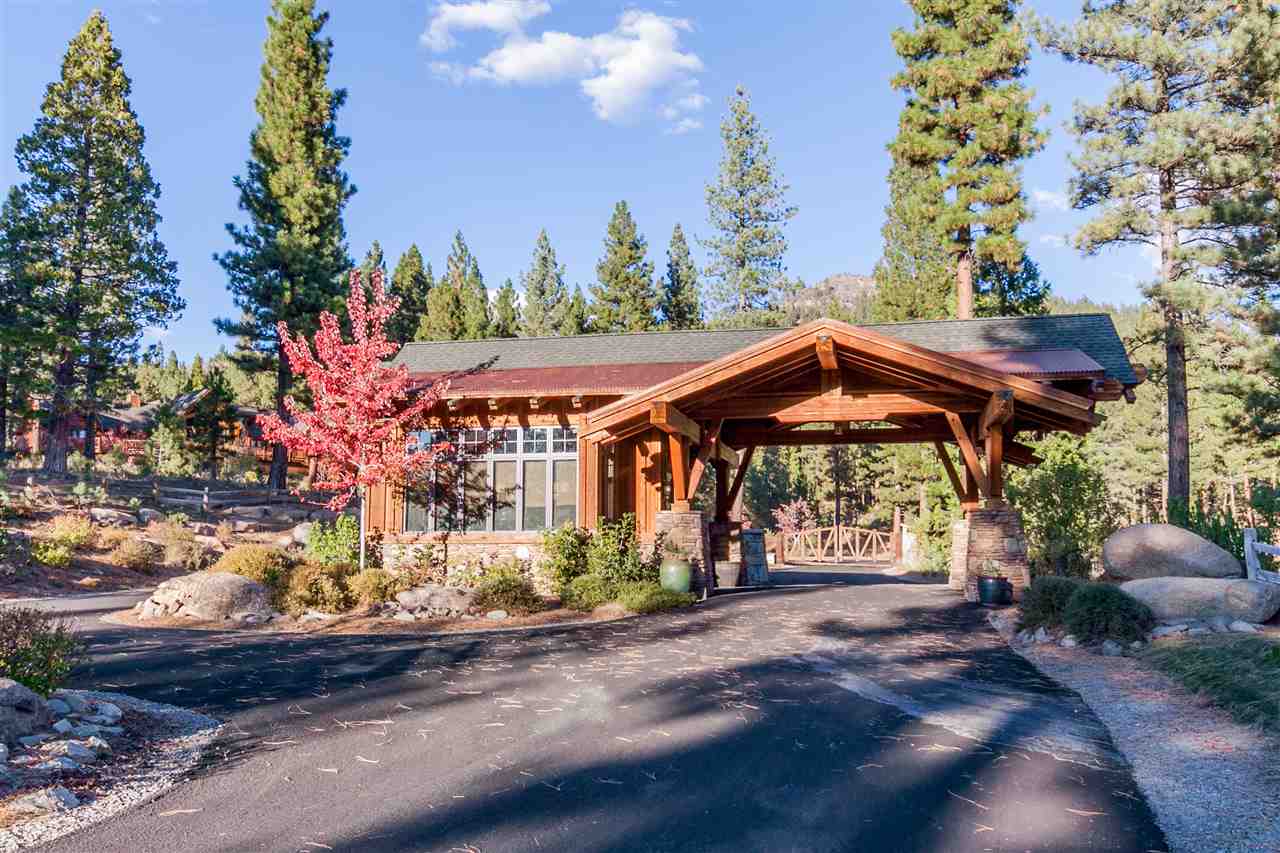 486 Grizzly Ranch Road Portola, CA 96122 - Photo 7 of 8 a view of a patio with table and chairs under an umbrella