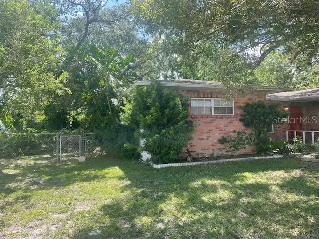a backyard of a house with lots of green space