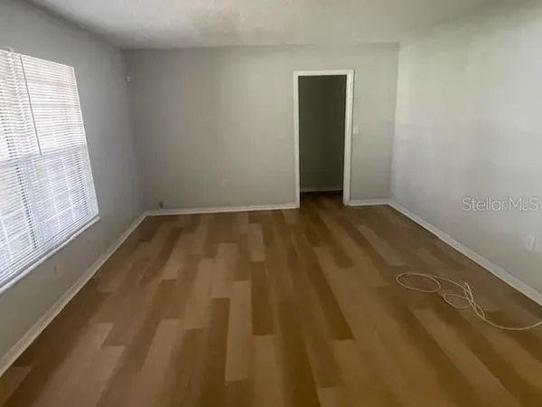 a view of an empty room and window