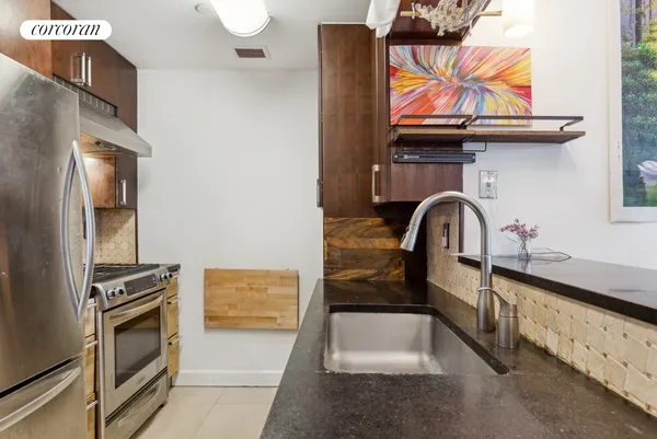 a kitchen with stainless steel appliances a sink and a stove