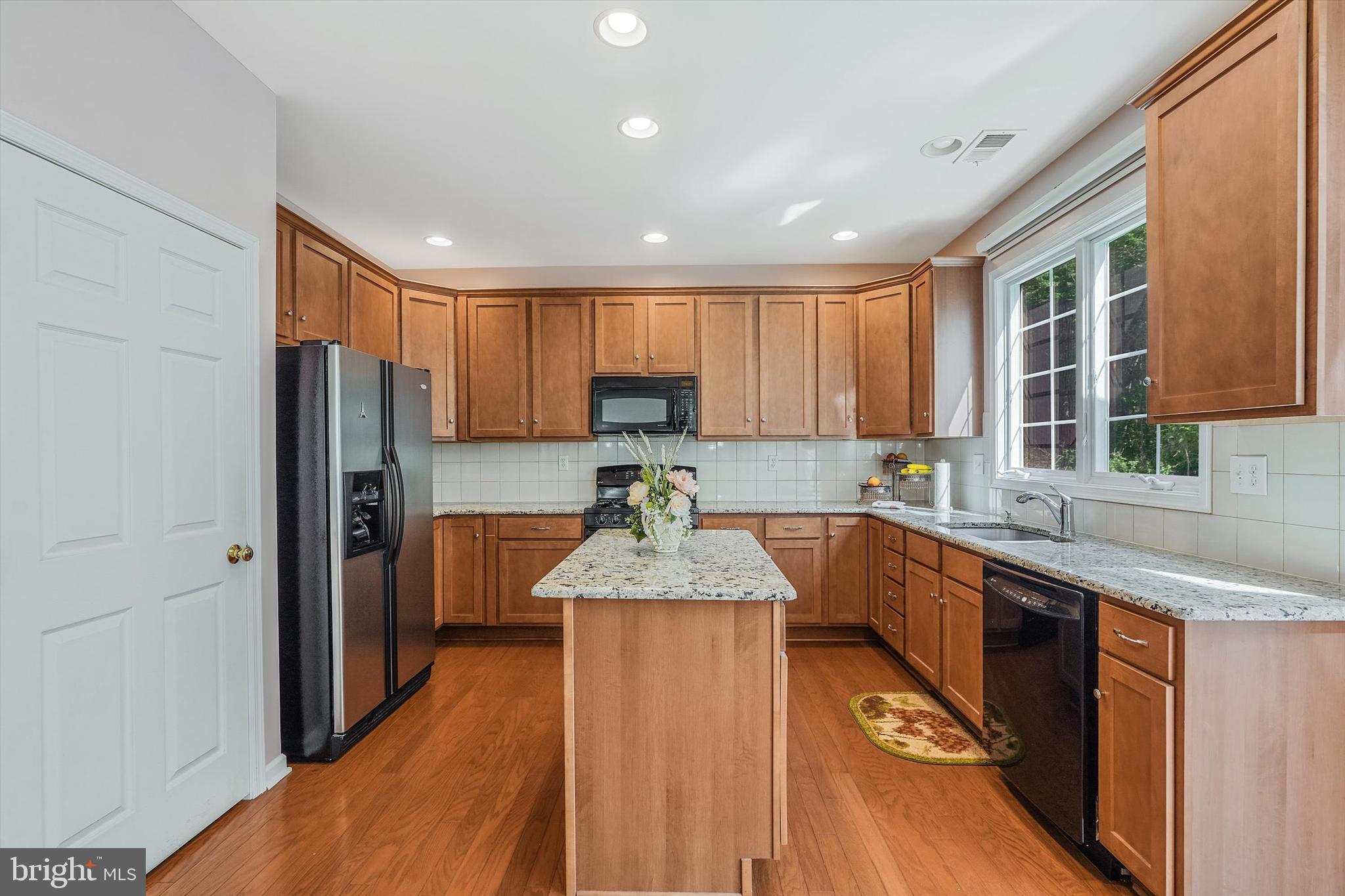 14 Devonshire Drive Princeton, NJ 08540 - Photo 12 of 36 a large kitchen with granite countertop a large counter top stainless steel appliances and cabinets