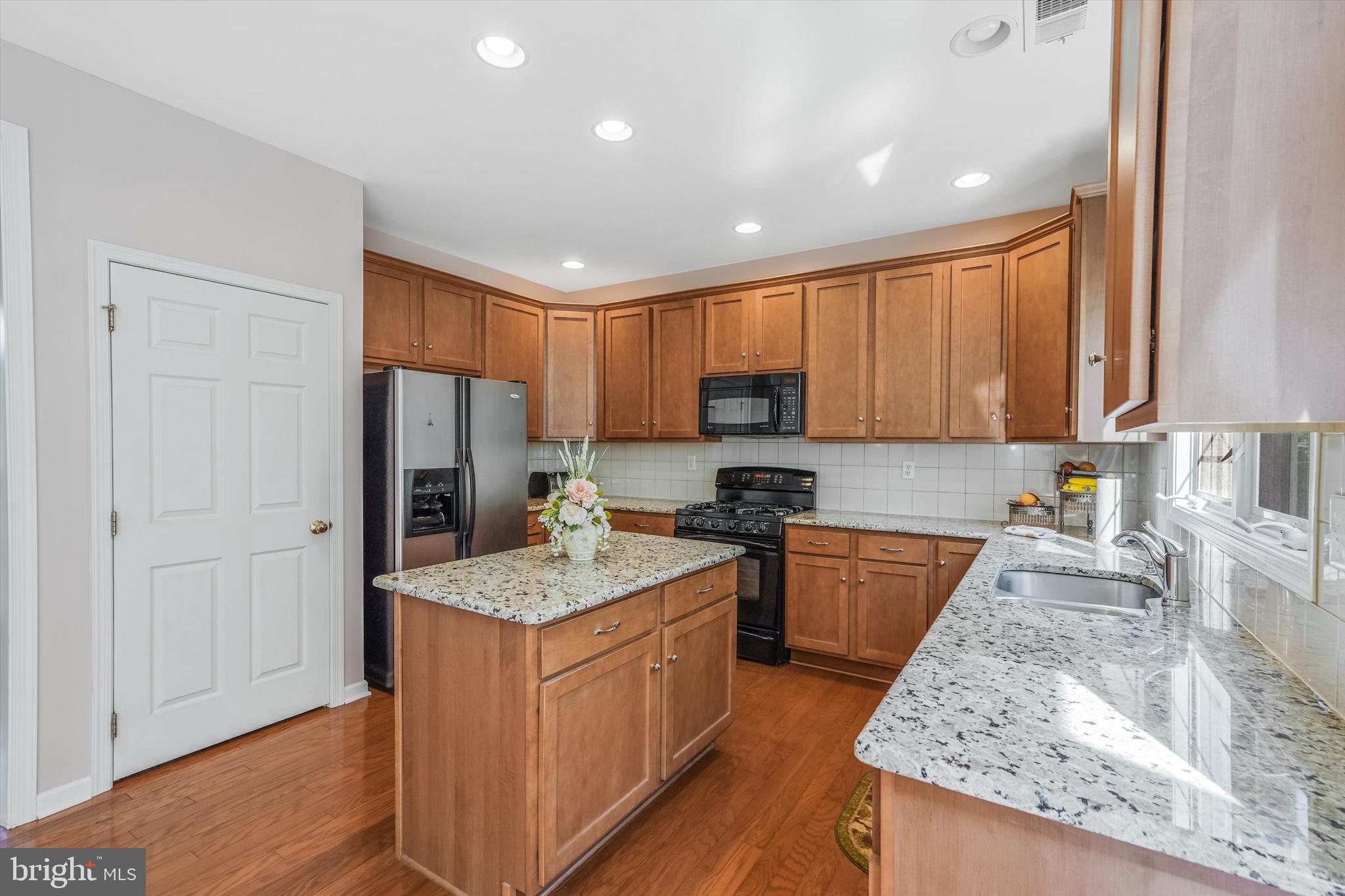 14 Devonshire Drive Princeton, NJ 08540 - Photo 13 of 36 a kitchen with a sink stove and refrigerator