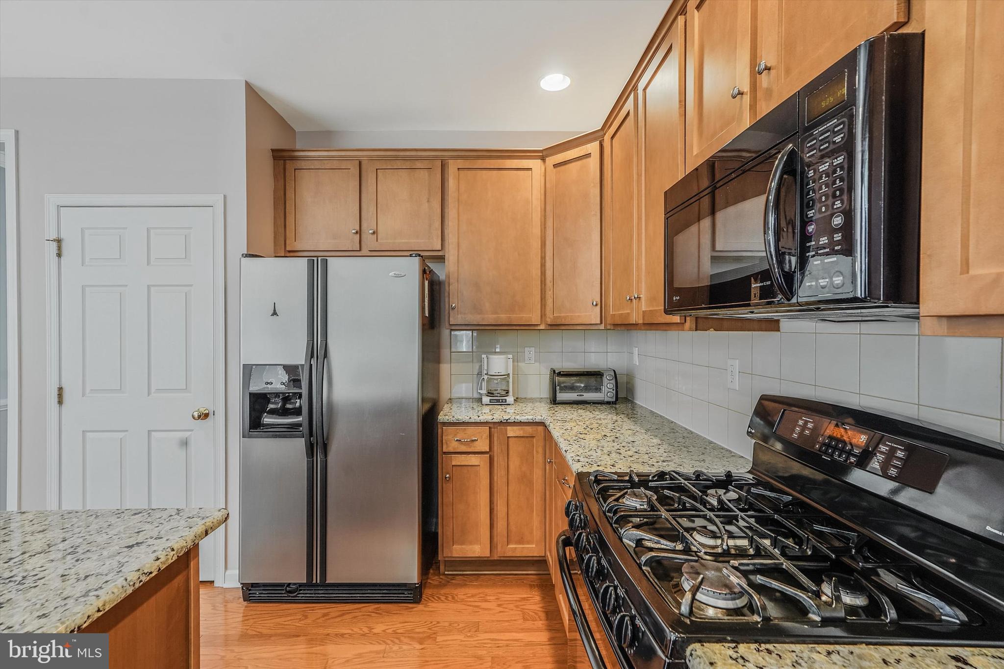 14 Devonshire Drive Princeton, NJ 08540 - Photo 15 of 36 a kitchen with stainless steel appliances granite countertop a refrigerator stove top oven and sink