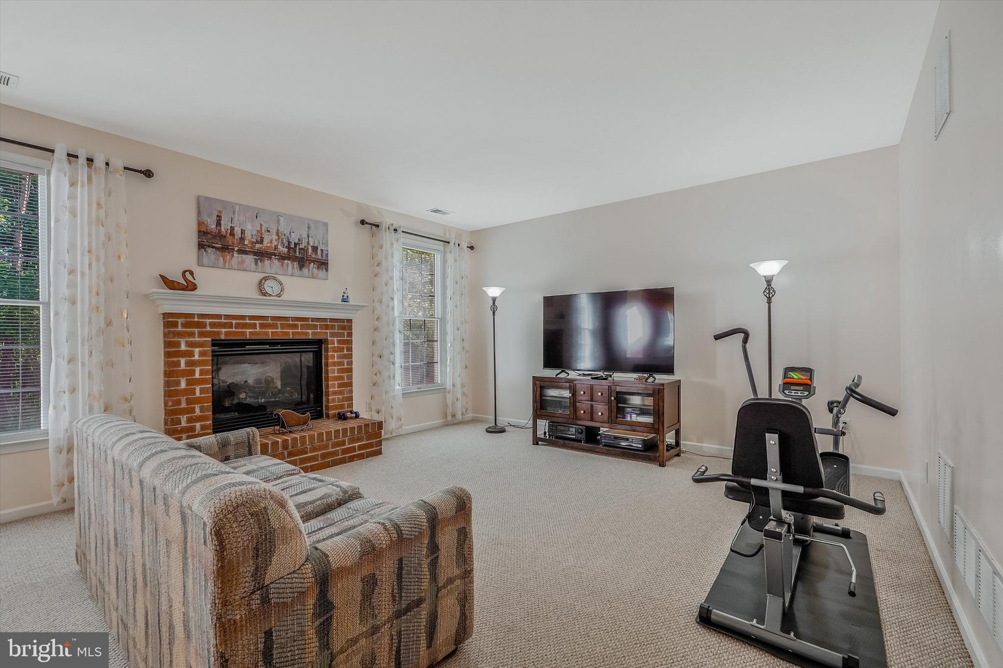 14 Devonshire Drive Princeton, NJ 08540 - Photo 16 of 36 a living room with furniture and a flat screen tv