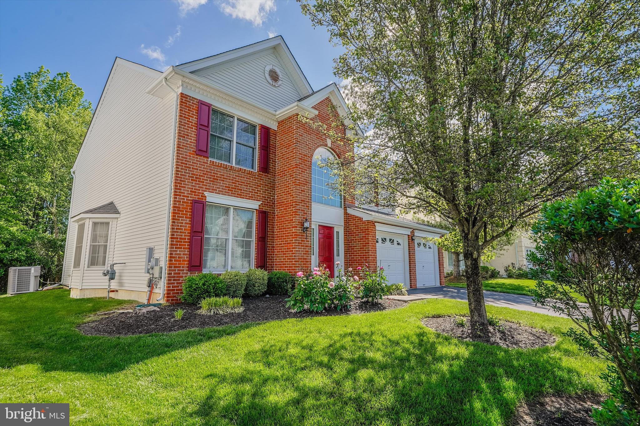 14 Devonshire Drive Princeton, NJ 08540 - Photo 5 of 36 a front view of a house with a yard and trees