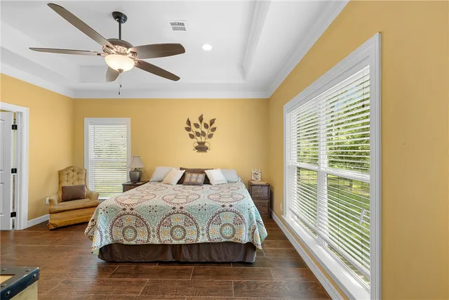 a bedroom with a bed and window