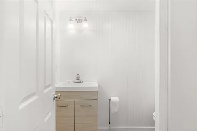 a bathroom with a sink a vanity and a mirror